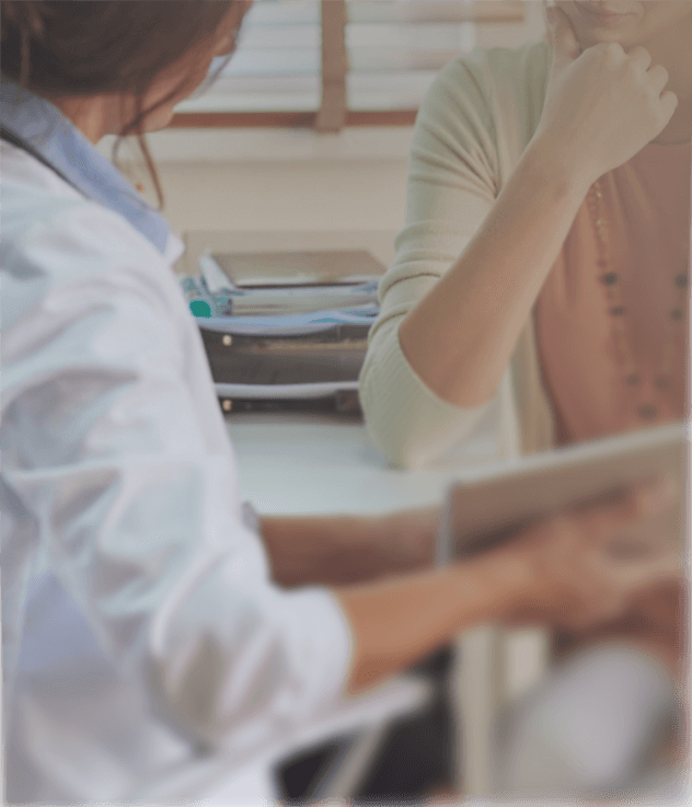 Doctor speaking to a female patient during a medical consultation