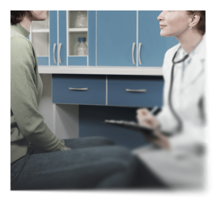 emale doctor in a white coat with a stethoscope consulting with a patient in a medical office